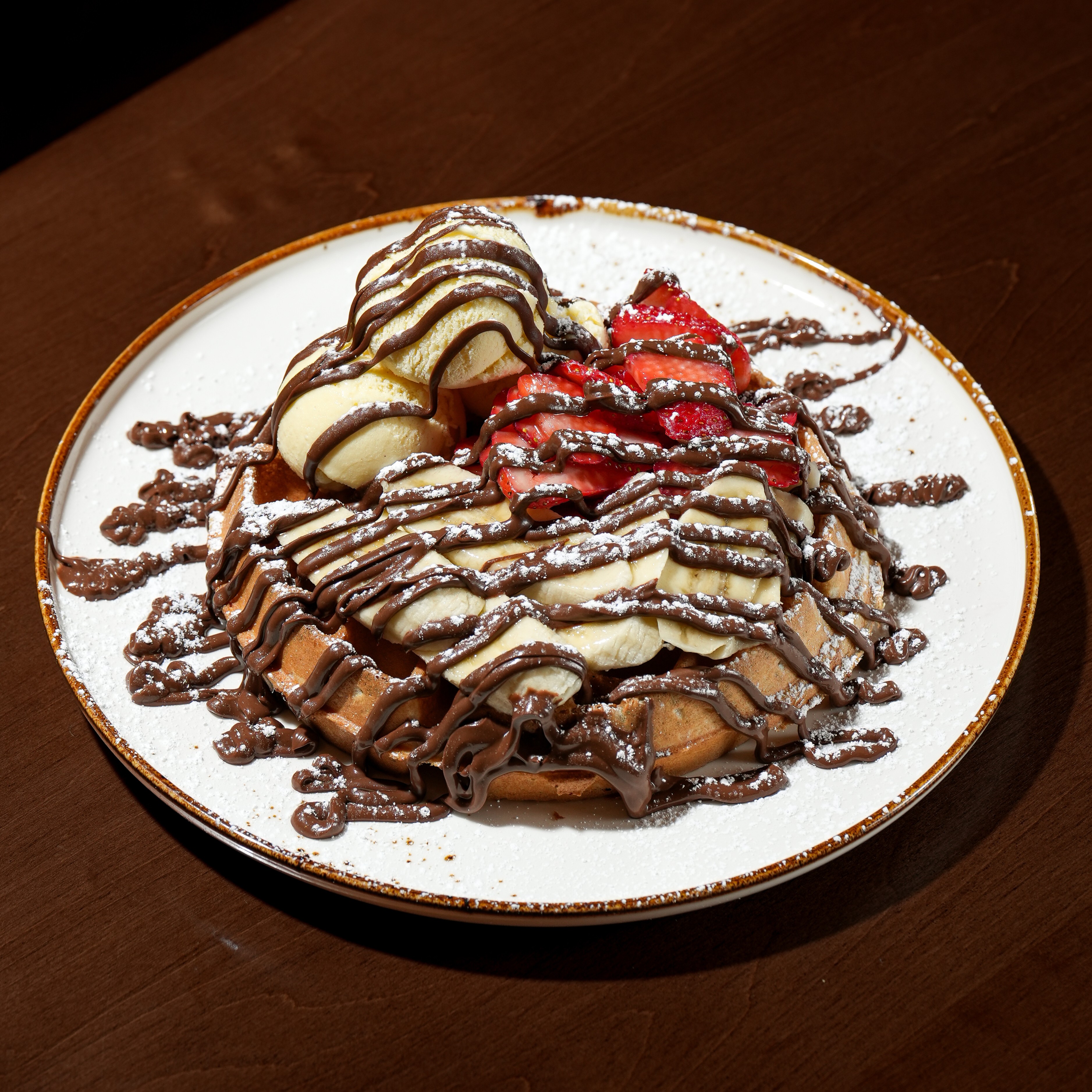 Nutella Dream Waffle — Nutella, banana, strawberries, vanilla ice cream, and icing sugar. — Sweet Brunch at SOLENA Brunch & Bar in Corso Italia, Toronto