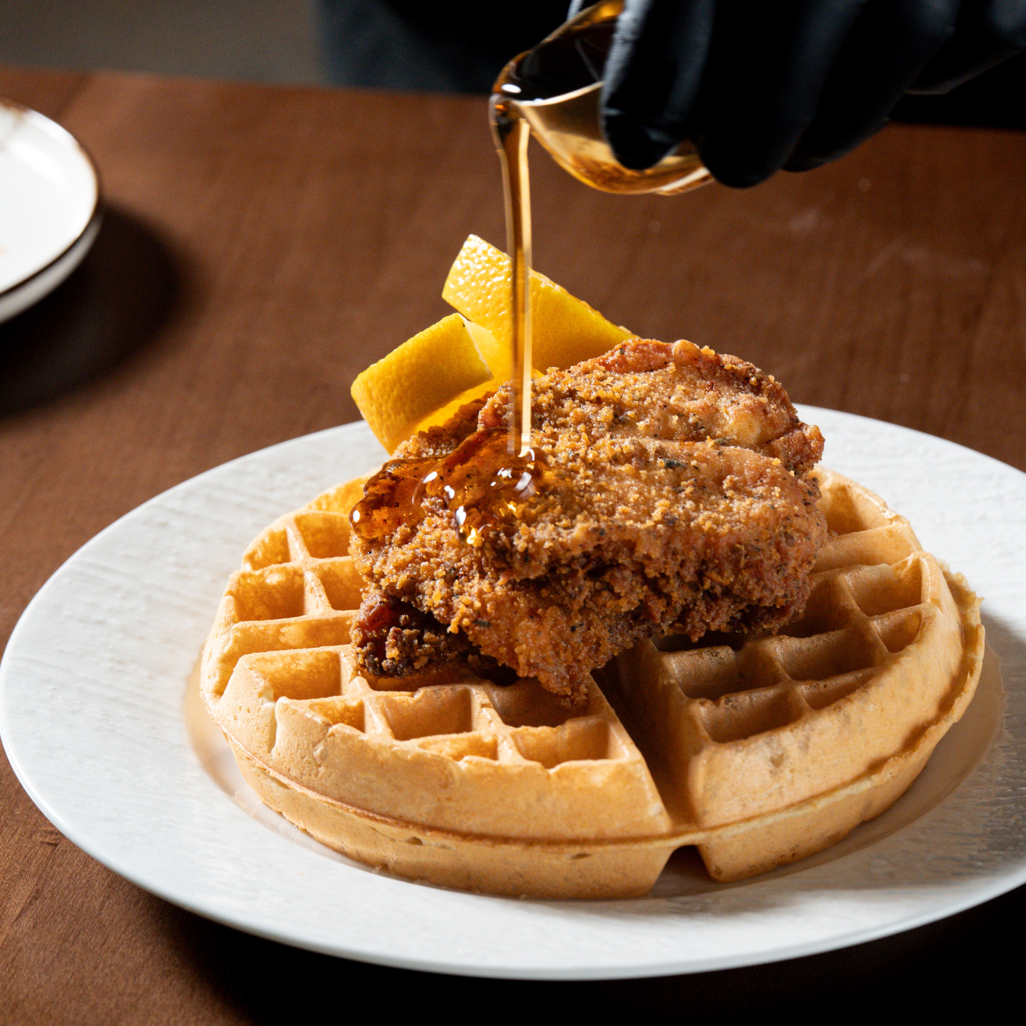 Chicken & Waffle — Crispy fried chicken served on a Belgian waffle with maple syrup. — Sweet Brunch at SOLENA Brunch & Bar in Corso Italia, Toronto