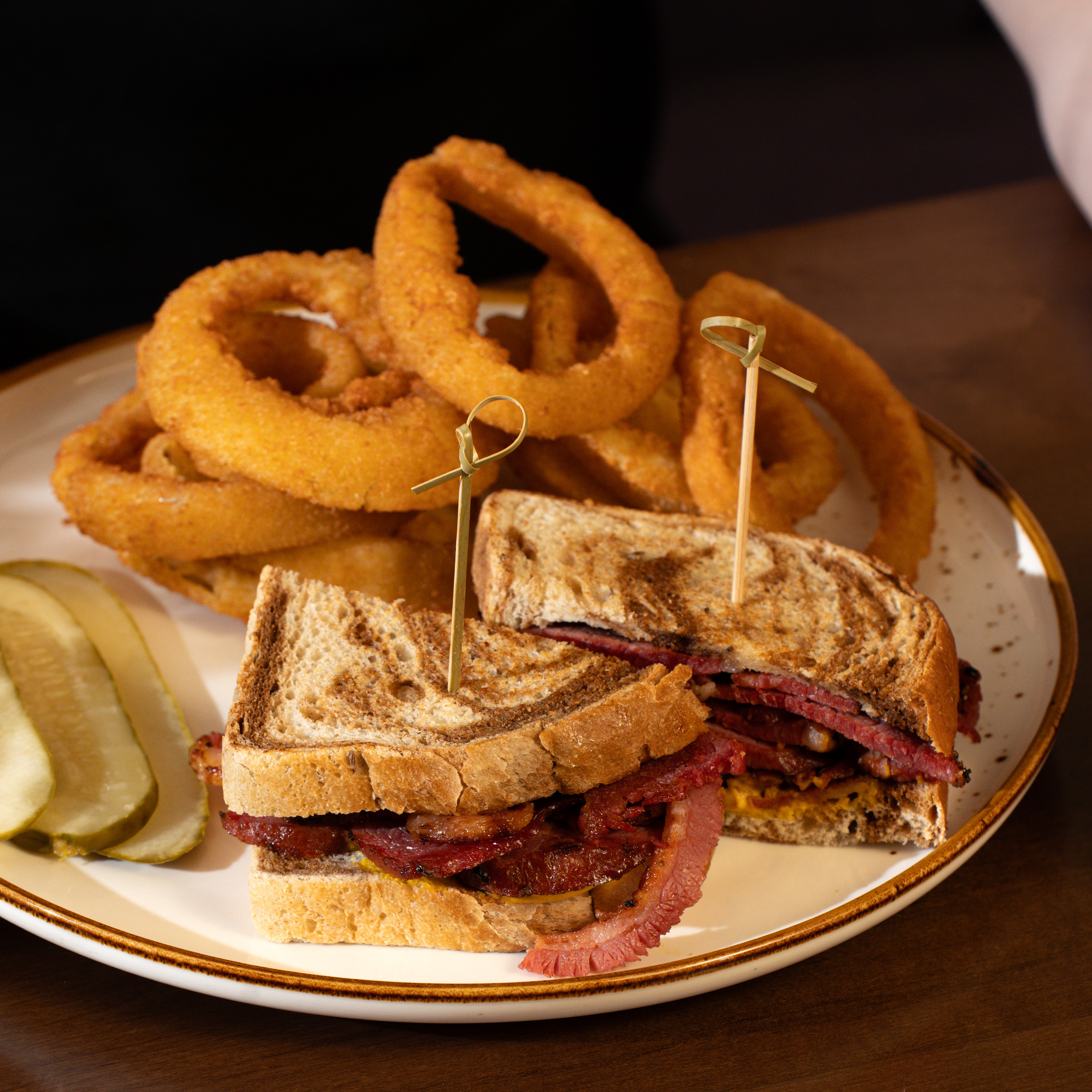 Montreal Smoked Meat — Classic smoked meat with yellow mustard on toasted rye. — Handhelds at SOLENA Brunch & Bar in Corso Italia, Toronto